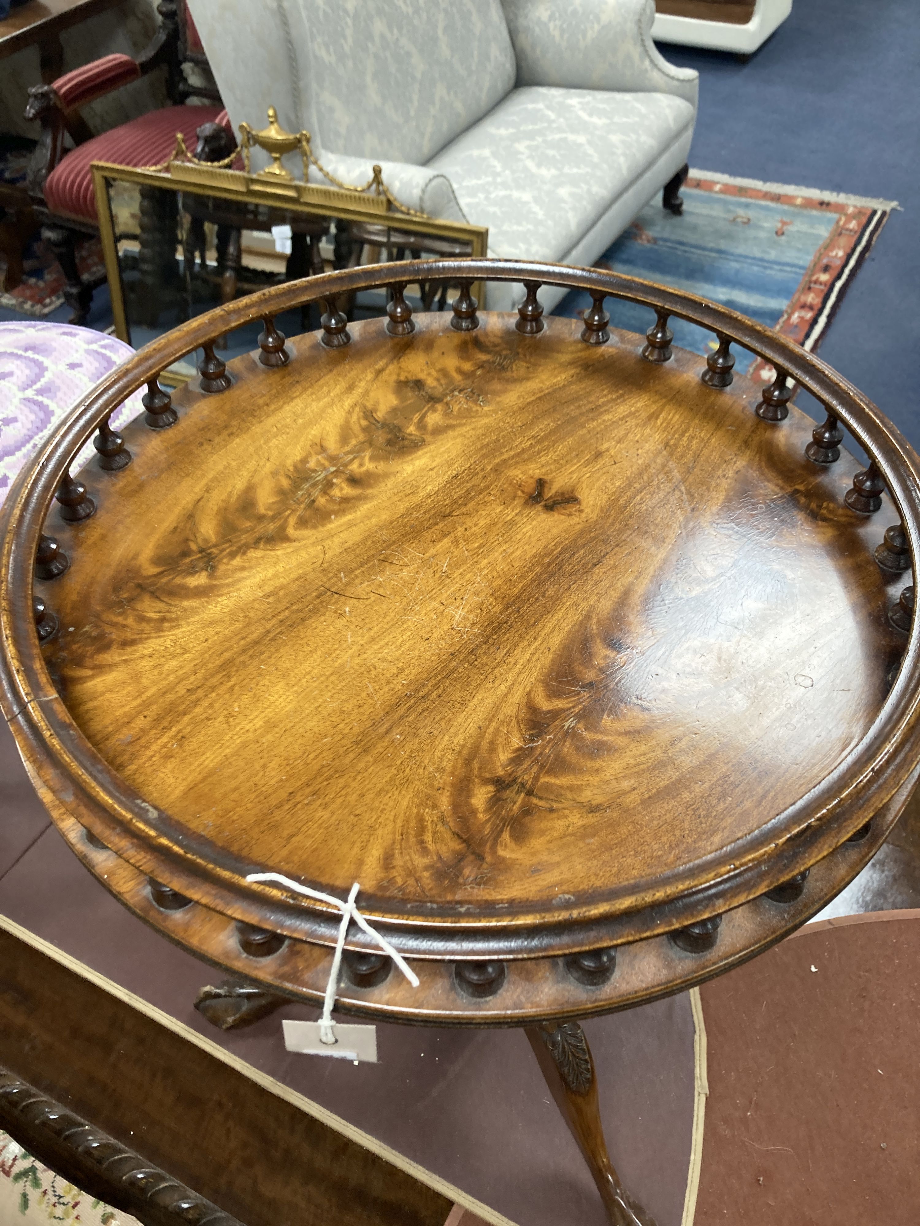 A pair of reproduction George III style mahogany galleried tripod wine tables, 48cm diameter, height 63cm